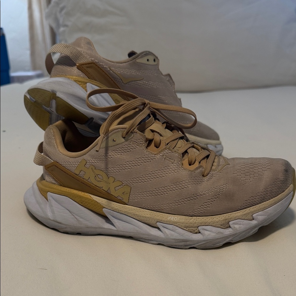 Hoka Women’s Beige and Gold Athletic Shoes
